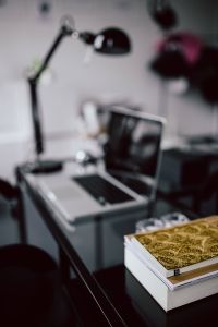Kaboompics - Close-up of golden journals in the office
