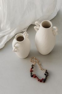 Kaboompics - Elegant Jewelry and Decor: Necklaces, Bracelets, and Vases - Free Stock Photo Collection