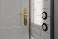 Kaboompics - Antique gold plated door handle & light switch