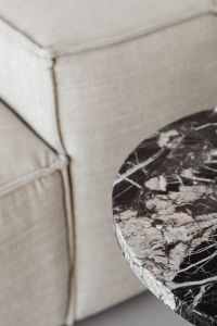 Kaboompics - Marble side table - round - greige linen sofa - cement floor