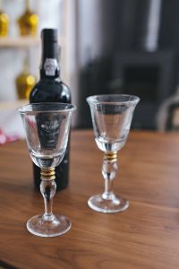 Kaboompics - Two empty wine glasses with a bottle of wine on a table