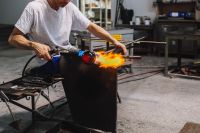 Glassworker in action in the Murano glass factory