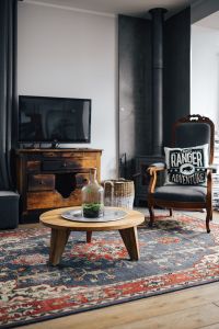 Kaboompics - Living room, wooden furniture, table, armchair, tv, carpet