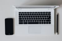 Kaboompics - White laptop with smartphone