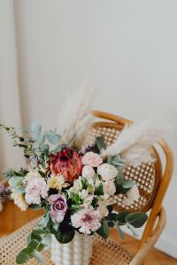 Kaboompics - Beautiful bouquet of flowers on a wooden chair