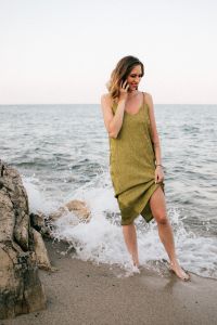 Kaboompics - A beautiful woman on the beach is talking on the phone