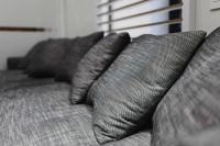 Kaboompics - Grey long sofa with pillows
