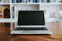 Kaboompics - Silver laptop on a wooden table