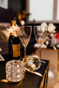 New Year's Eve party - open bottle of champagne and glasses