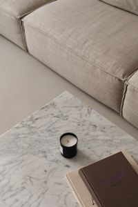 Kaboompics - Living room - gray beige sofa - marble coffee table - coffee table books - candle