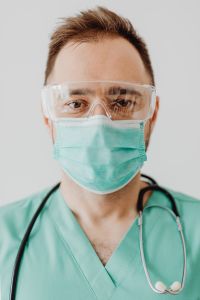Doctor with stethoscope and medical mask