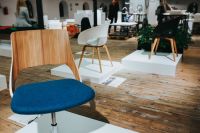 Kaboompics - Various designer chairs and tables on an exhibition