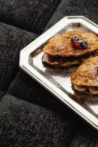 Indulgent Berry-Banana French Toast Feast - Elegant Breakfast with Raspberries and Blueberries