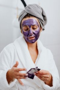 Woman with facial skincare mask