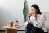 Kaboompics - Asian adult sits in chair and drink coffee - Chemex
