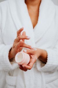 Kaboompics - A middle-aged woman applying hand cream