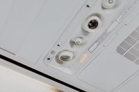 Kaboompics - Cabin inside the aircraft, lights, air condition and signs panel above the seat