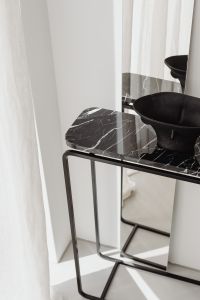 Kaboompics - Black ceramic vase - mirror - black Nero Marquina marble console