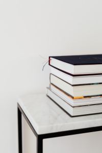 Kaboompics - Books On Marble Table, White Background