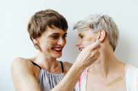 Kaboompics - Girls paint an LGBT rainbow on their bodies