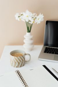 Kaboompics - Laptop - white flowers - organizer & cup of coffee on marble table