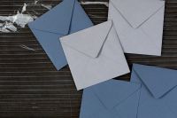 Blue & white envelopes on marble