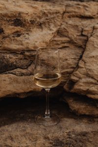 Coastal Elegance - White Wine on the Rocky Shores of Malta