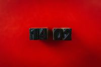 Kaboompics - Numbers on a red background