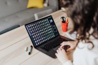 Kaboompics - Woman works on laptop