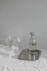 Kaboompics - Refined Hydration - Artisan Water and Glassware on Metallic Tray