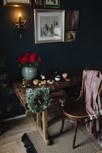 Kaboompics - New Yorker, some nuts, watches, and other things on the old, wooden table, wreath