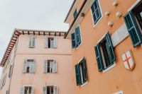 Pastel pink building with turquoise shutters, Rovinj, Croatia