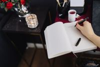 Kaboompics - Woman writing on notebook