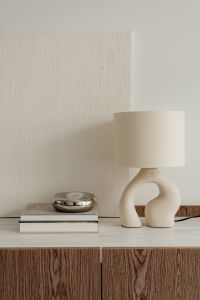 Kaboompics - Ceramic lamp styled on a commode with a stone top