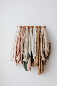 Kaboompics - Sweaters on a hanger