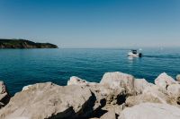 View from the rocky coast at the Adriatic Sea in the town of Izola, Slovenia