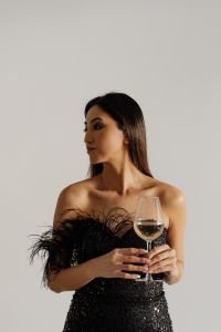 Kaboompics - Classy aesthetics - beautiful Asian woman in black evening dress - white wine in a glass