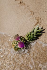 Kaboompics - Pineapple with sunglasses on the beach