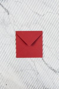 Kaboompics - Red envelope on marble