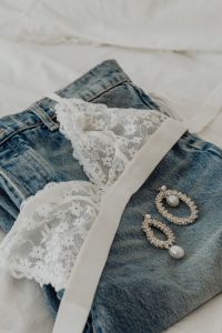 Kaboompics - White lace triangle top - jeans - silver earrings with cubic zirconia and pearl