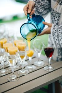 Glasses of orange juice, wine and water