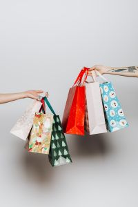 Hands holding gift bags