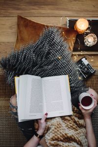 Kaboompics - Woman drinking tea and reading book
