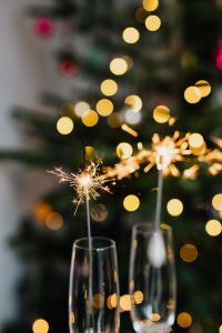 New Year's Eve - champagne glasses on a Christmas tree background