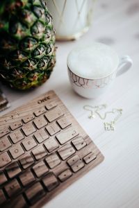 Kaboompics - Wooden keyboard, coffee and pineapple