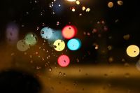 Kaboompics - Colourful city lights through a wet car window