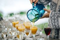 Kaboompics - Glasses of orange juice, wine and water