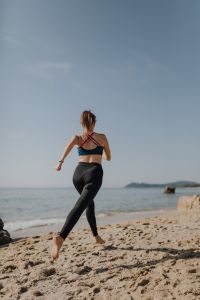 Kaboompics - Woman jogging on the beach - running