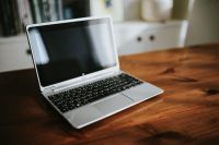 Kaboompics - Silver laptop on a wooden table