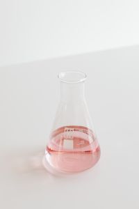 Kaboompics - Conical flask with pink liquid